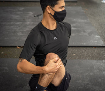 Seated Spinal Twist wearing the Dorsum Exospine Back Support to increase mobility.